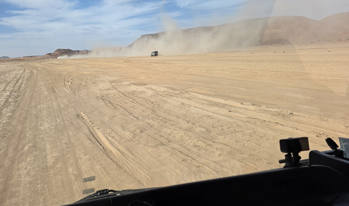 <span  class="uc_style_uc_tiles_grid_image_elementor_uc_items_attribute_title" style="color:#ffffff;">Driving through the desert</span>